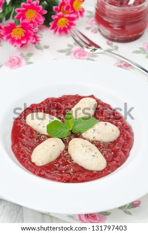 cottage cheese gnocchi with strawberry sauce vertical top view
