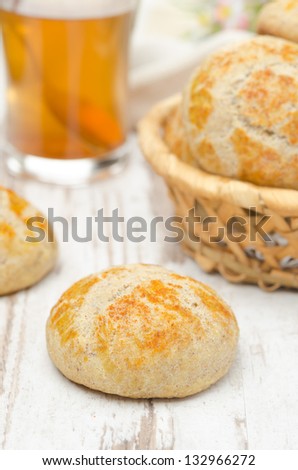 cottage cheese bread rolls and a cup of tea on a white table closeup