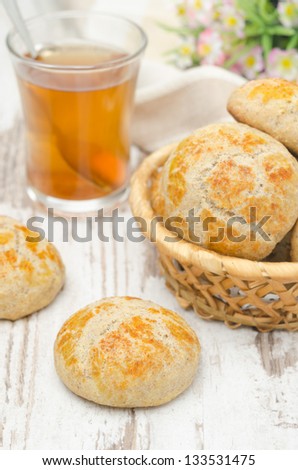 cottage cheese bread rolls and a cup of tea on a white table