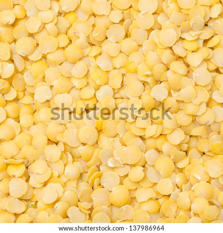 yellow lentils background closeup