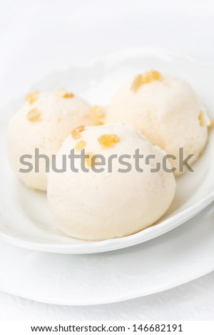 Ginger ice cream with melted milk, close-up, vertical