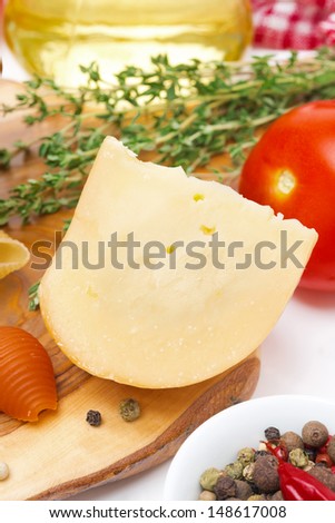 fresh cheese and spices on a wooden board close-up vertical