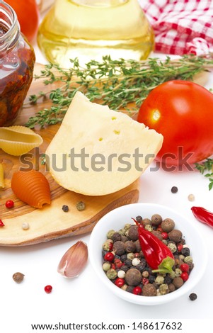 cheese, spices, tomato and olive oil close-up