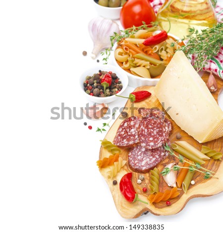 Italian food - cheese, sausage, pasta, spices, tomatoes, isolated on white