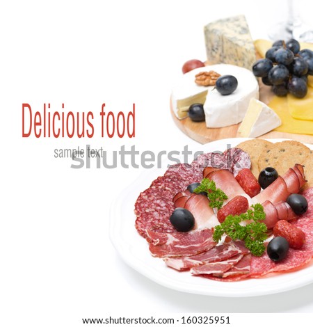 assorted deli meats and a plate of cheese, isolated on white