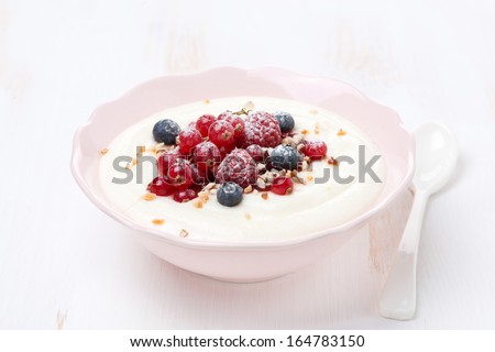 semolina porridge with berries and nuts, horizontal, close-up