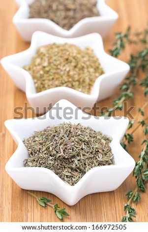 Provence herbs - thyme, oregano and basil, selective focus, isolated on white