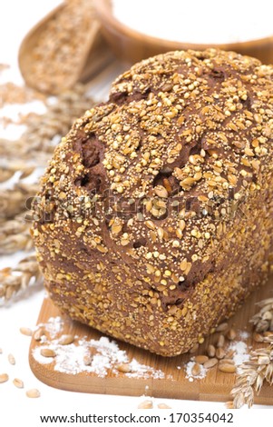 whole grain bread with seeds, close-up, vertical