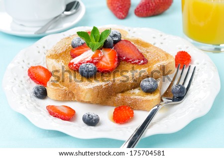 crispy toast with honey, fresh berries, coffee and orange juice for breakfast horizontal