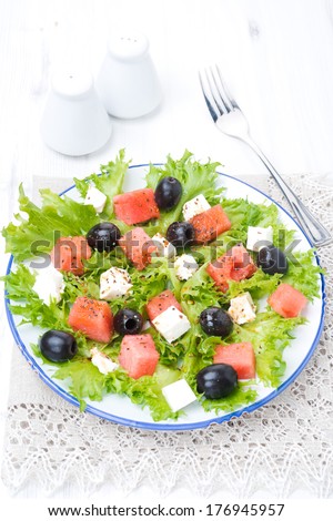 salad with watermelon, feta cheese and olives, vertical top view