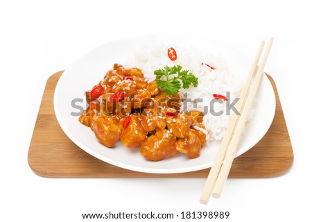Chinese food - chicken in tomato sauce with sesame seeds and rice, isolated on white