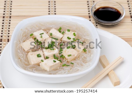 soup with rice noodles and marinated tofu, close-up