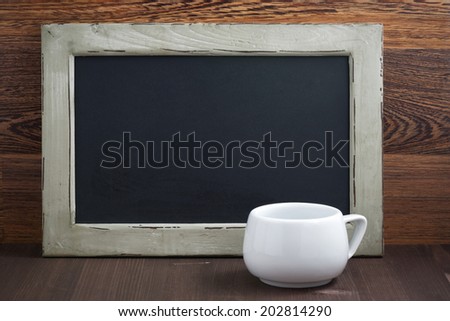 black writing board and white cup, horizontal