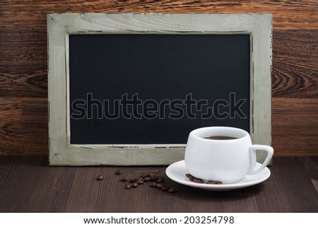 black writing board and a cup of coffee, horizontal