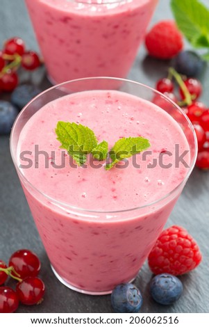 berry milkshake in glass, top view, vertical, top view