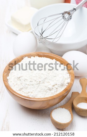 flour, salt, sugar and eggs for baking pancakes, vertical, close-up