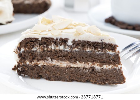 piece of chocolate cake with butter cream, close-up, horizontal