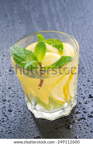 mint lemonade on a dark background, close-up, vertical, top view