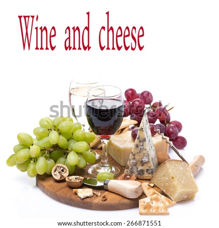 two glasses of wine, grapes and cheese assortment on a wooden board, isolated on white