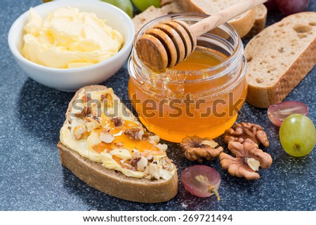 honey, bread with butter and grape, horizontal, top view, close-up