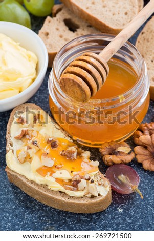 honey, bread with butter and grape, vertical, top view, close-up