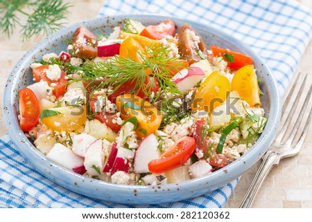 dietetic food - fresh salad with vegetables and cottage cheese, close-up