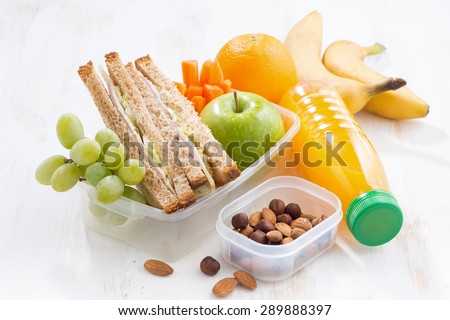 school lunch with sandwich on white table, close-up