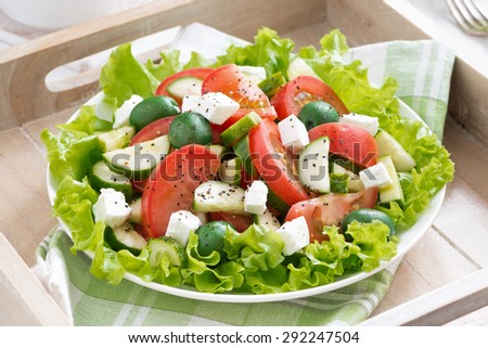 plate of green salad with vegetables, top view, horizontal