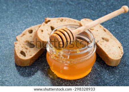 jar with honey and bread, horizontal