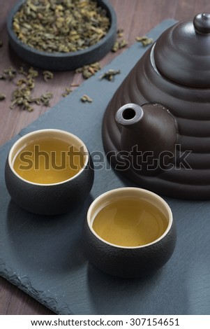 freshly brewed green tea in ceramic ware, vertical, top view