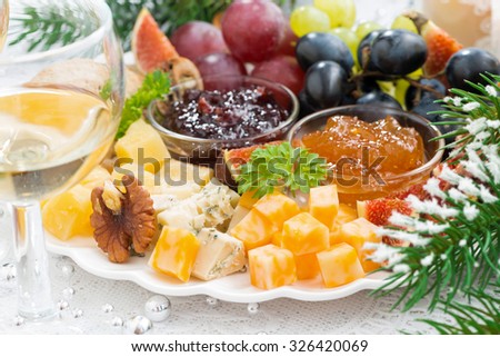 delicacy cheese and fruit plate, closeup, horizontal