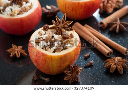 prepared for baking stuffed apples on a black background, horizontal