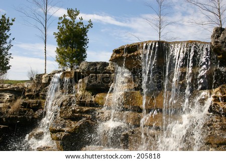 A waterfall as the focal point in this landscaping job.
