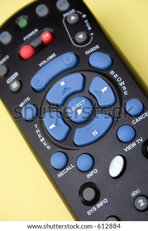 A close up view of a remote control for a satellite system television receiver
