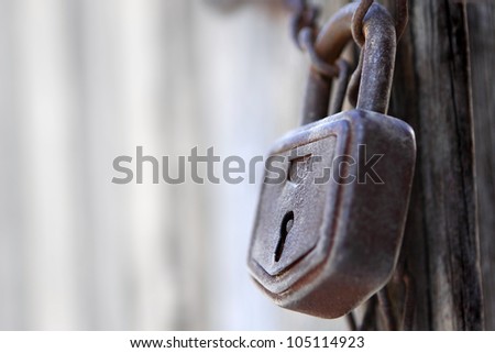 Close-up of lock and chains on old door
