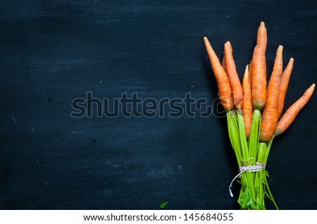 Bunch Of Ripe Carrots On A Black Background