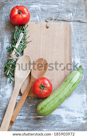 Background of a cutting board with spices and vegetables
