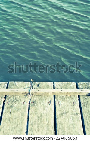 Beauty seascape in vintage colors. View from wood pier/Summer holidays background