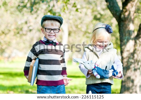 Portrait of a cute smart boy and girl. Education.