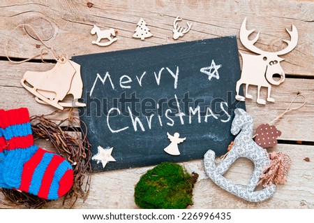 christmas decoration on a wooden background and blackboard for your text