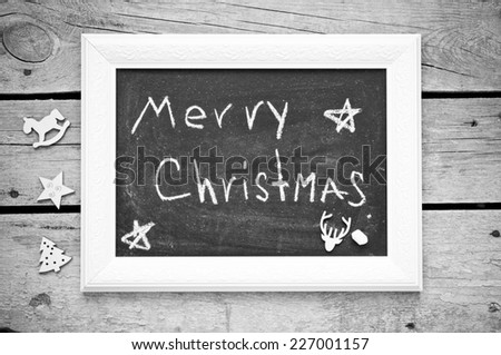 christmas decoration on a wooden background and blackboard for your text