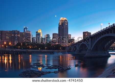 Downtown Minneapolis Minnesota & Partial Moon - St Anthony Falls and lock & dam in foreground