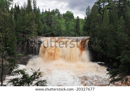 Gooseberry Falls Lower Falls after hard rain - water color is natural - pine trees in area release tannins into water causing it to turn brown