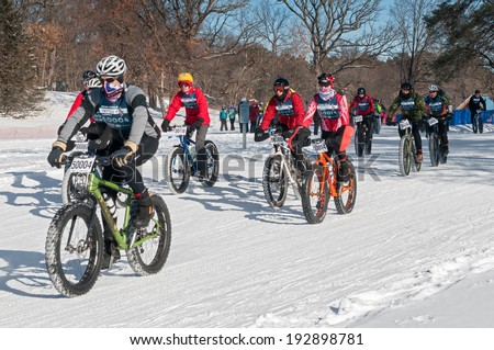 MINNEAPOLIS, MN -  FEBRUARY 2: Bicyclists head out from the start of the 2014 Penn Cycle Fat Tire Loppet on February 2, 2014 in Minneapolis, Minnesota.