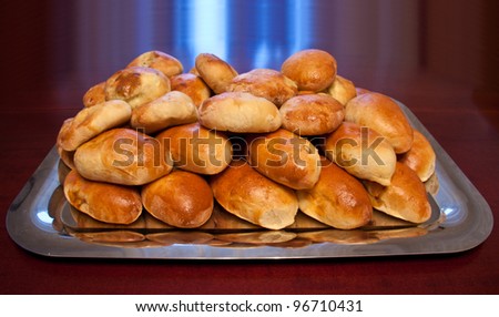 cooked baked fried pies at the shiny metal tray