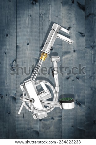 valves, pipes, sanitary ware, chrome-plated products on a wooden background