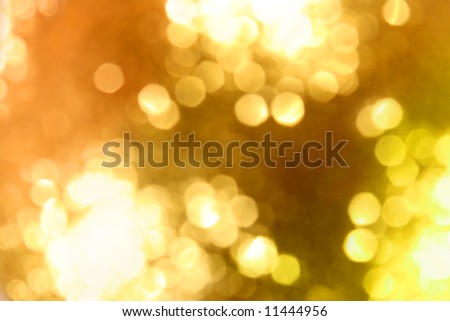 Abstract golden glow light background. Defocused shot of christmas ornament