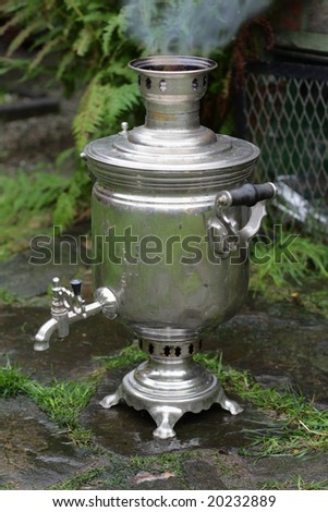 Real old-fashioned russian samovar smoking outdoor