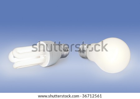 Energy saving concept: a low energy light bulb against a normal light bulb