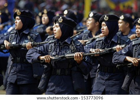 KUALA LUMPUR, MALAYSIA - AUGUST 31: Royal Malaysian Police personnels take part during the Independence Day celebration in Kuala Lumpur, Malaysia, 31 August 2013.